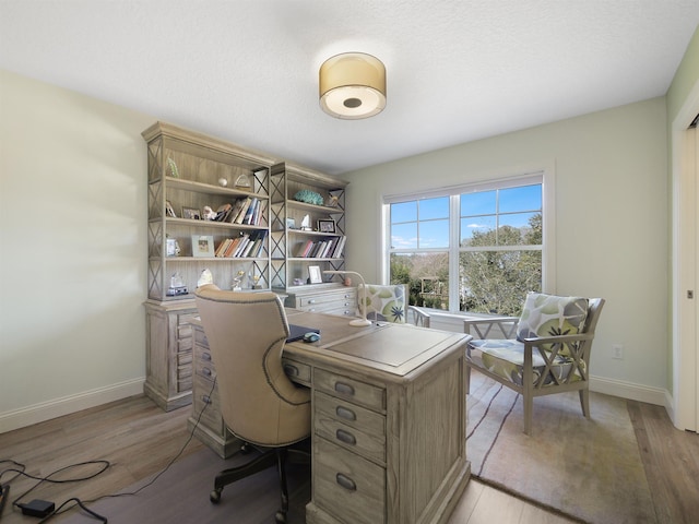 office space with light hardwood / wood-style flooring