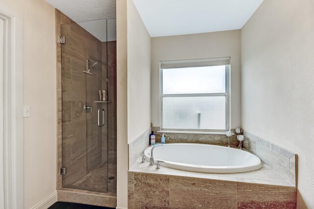 bathroom featuring plus walk in shower