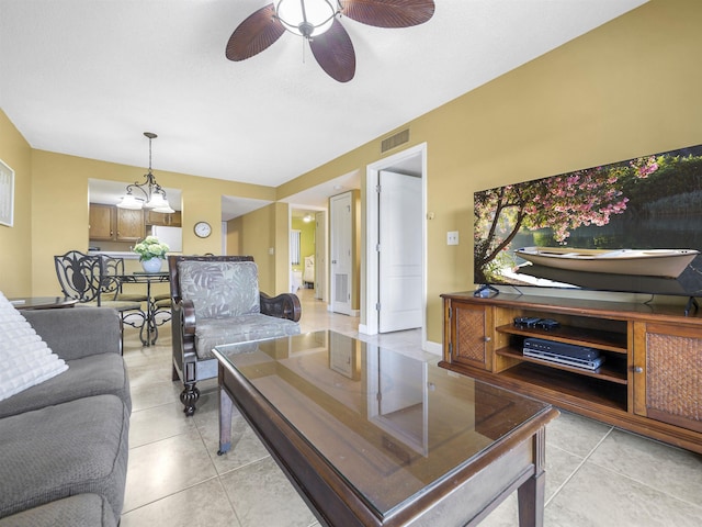 living room with ceiling fan and light tile patterned floors