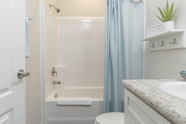 full bathroom with vanity, shower / bath combination with curtain, and toilet