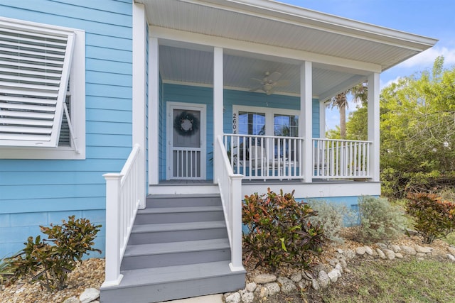 doorway to property with ceiling fan and covered porch