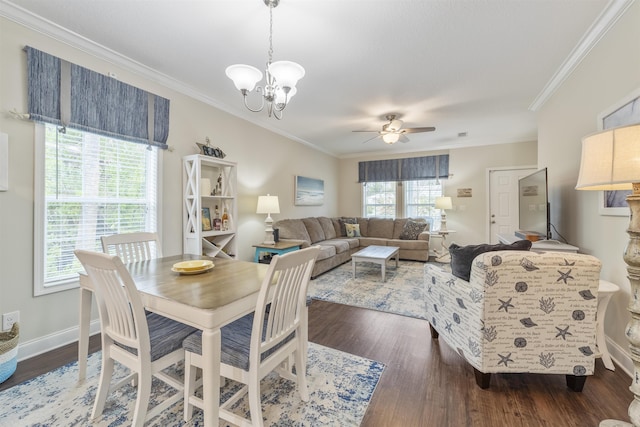 dining space with ceiling fan with notable chandelier, dark hardwood / wood-style flooring, and ornamental molding