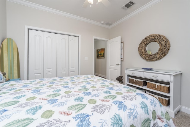 bedroom with carpet flooring, a closet, ceiling fan, and ornamental molding