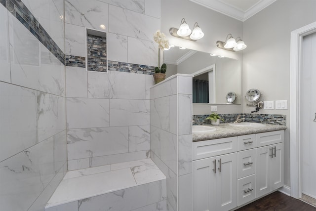 bathroom with hardwood / wood-style flooring, vanity, and ornamental molding