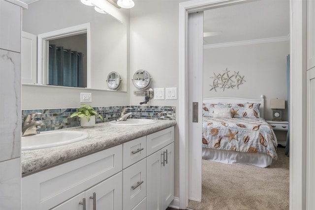 bathroom with vanity, tasteful backsplash, and crown molding