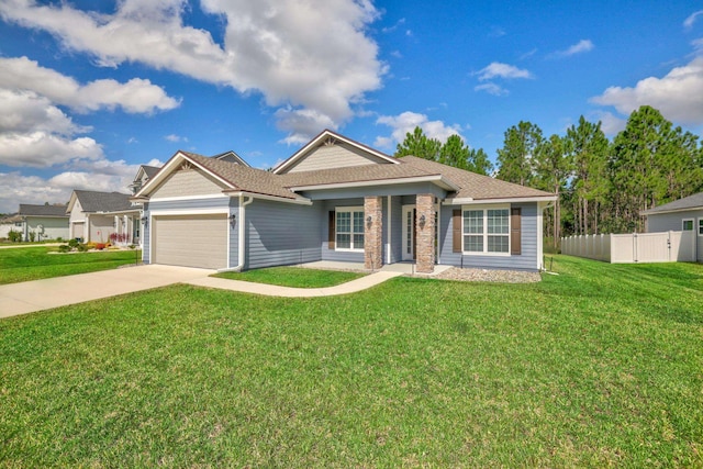 view of front of house with a front yard and a garage