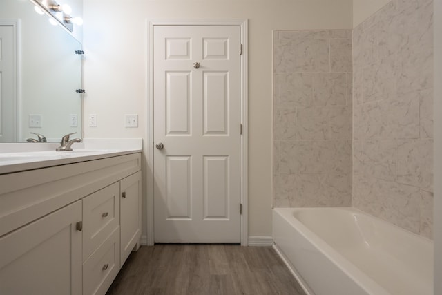 bathroom with vanity and wood-type flooring