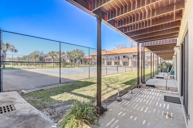 view of patio / terrace featuring tennis court