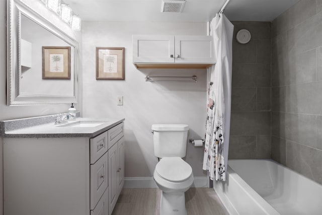 full bathroom featuring vanity, toilet, and shower / bath combo with shower curtain