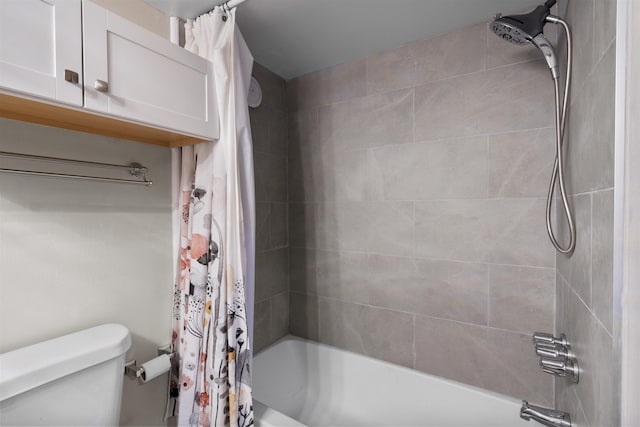 bathroom with shower / tub combo and toilet