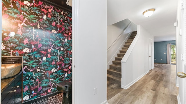 stairs with wood-type flooring