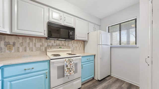 kitchen with blue cabinetry, tasteful backsplash, light hardwood / wood-style floors, white appliances, and white cabinets