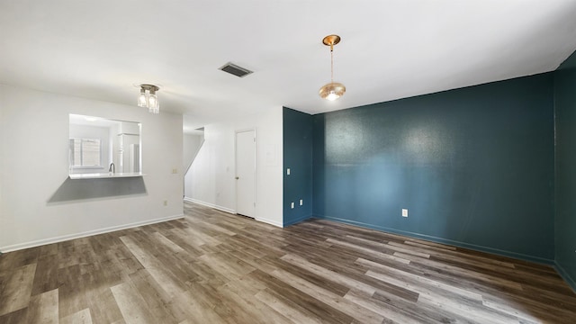 empty room featuring wood-type flooring