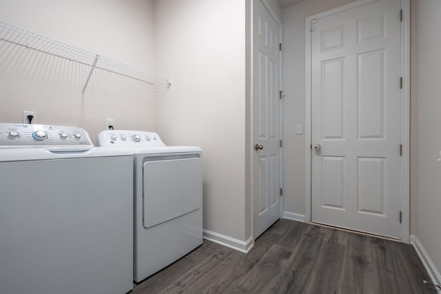 638 Honeycomb Trl, Saint Augustine, FL 32095 - laundry room with dark wood-style flooring, baseboards, washer and dryer, and laundry area
