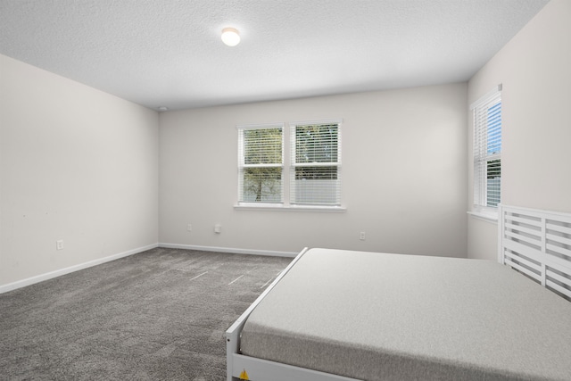638 Honeycomb Trl, Saint Augustine, FL 32095 - carpeted bedroom featuring baseboards and a textured ceiling