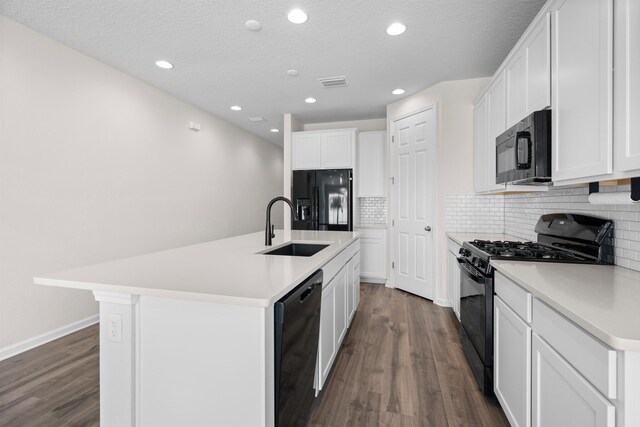 638 Honeycomb Trl, Saint Augustine, FL 32095 - kitchen featuring a sink, visible vents, black appliances, and dark wood finished floors