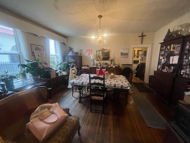 dining room featuring dark hardwood / wood-style floors and a notable chandelier