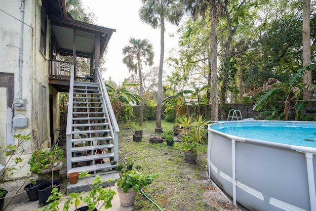 view of yard featuring a fenced in pool