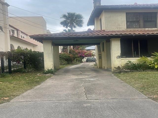 view of parking / parking lot with a carport