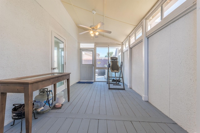 unfurnished sunroom featuring lofted ceiling and ceiling fan