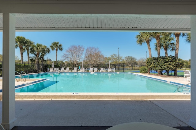 pool featuring a patio and fence