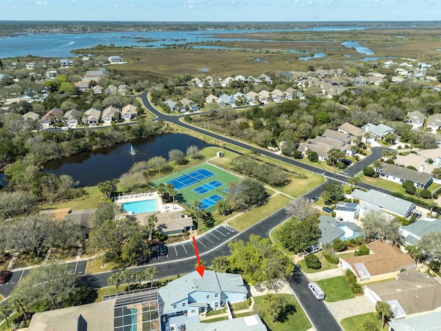 birds eye view of property featuring a residential view and a water view