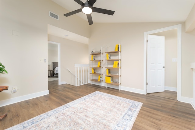 sitting room with visible vents, baseboards, ceiling fan, an upstairs landing, and wood finished floors