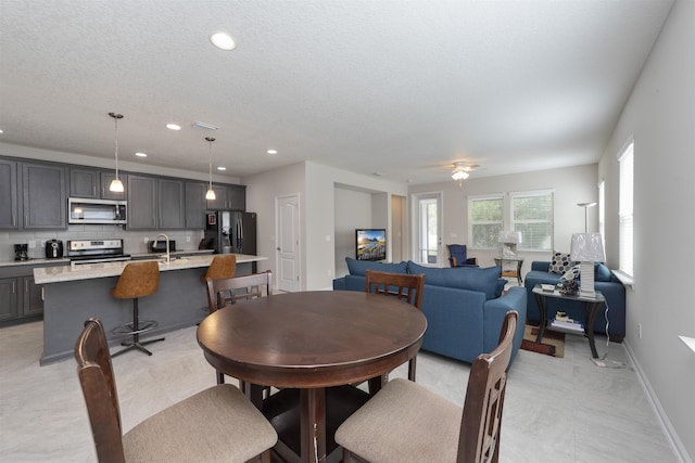 dining room with a textured ceiling