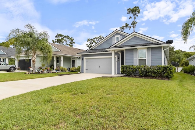 view of front of property featuring a garage and a front lawn