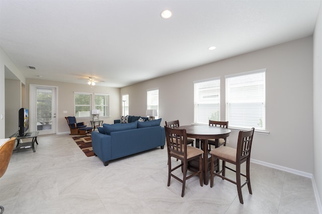 dining area with ceiling fan