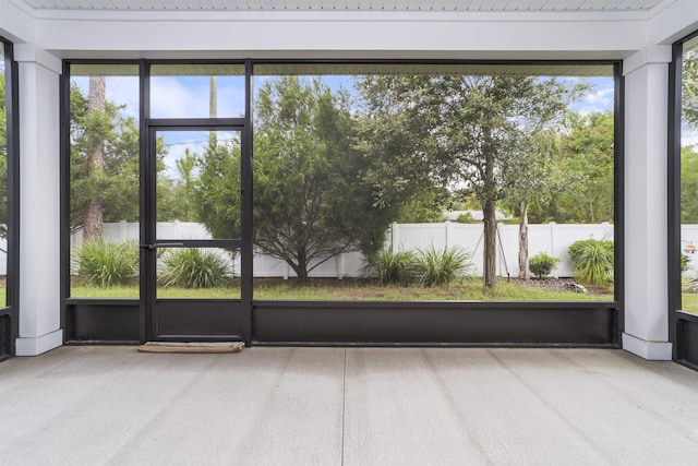 unfurnished sunroom featuring a wealth of natural light