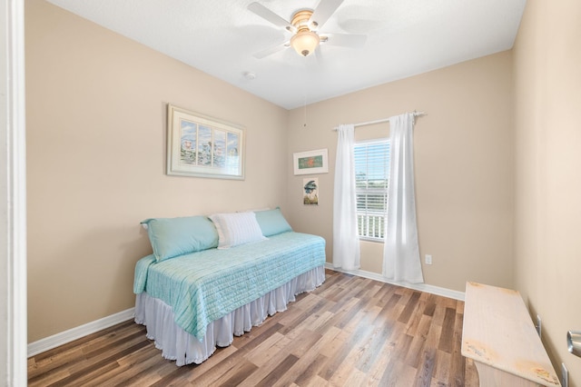 bedroom featuring ceiling fan and hardwood / wood-style floors