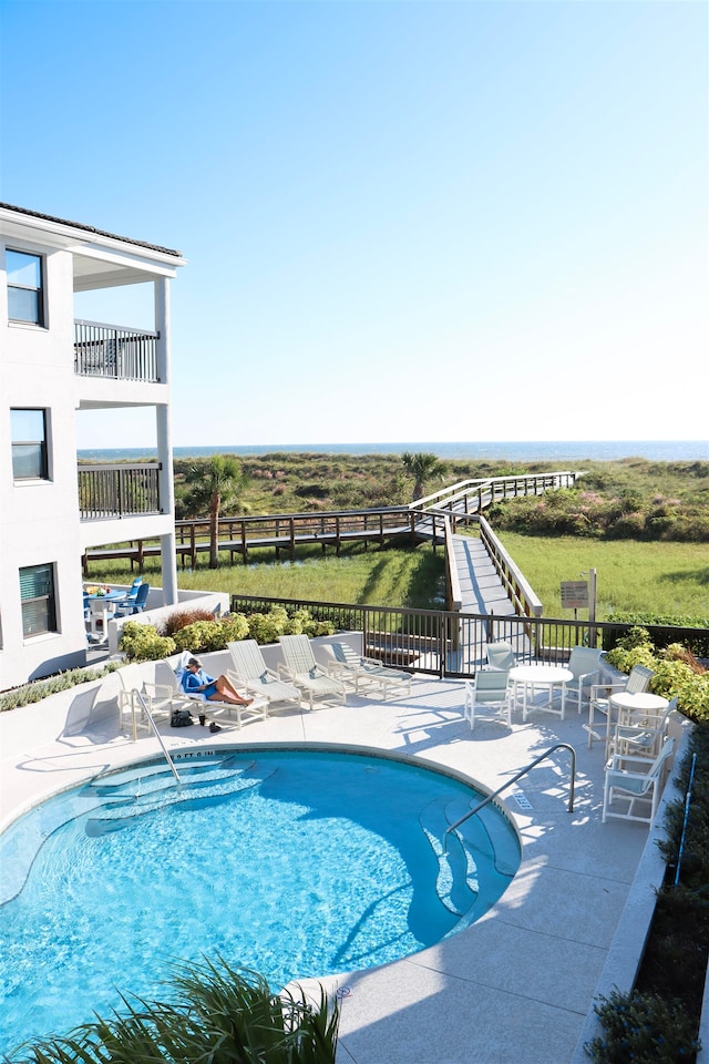 pool featuring a patio area