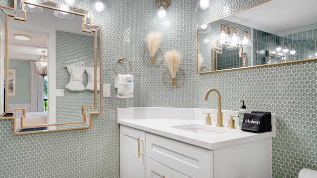 ensuite bathroom with ensuite bath and vanity