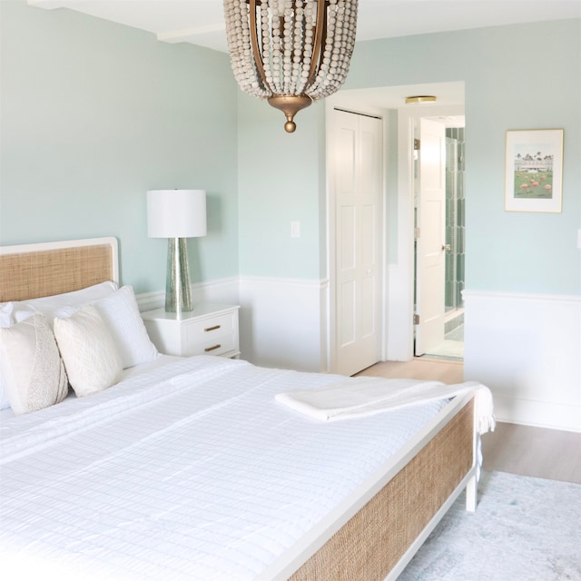 bedroom with a closet and wood finished floors