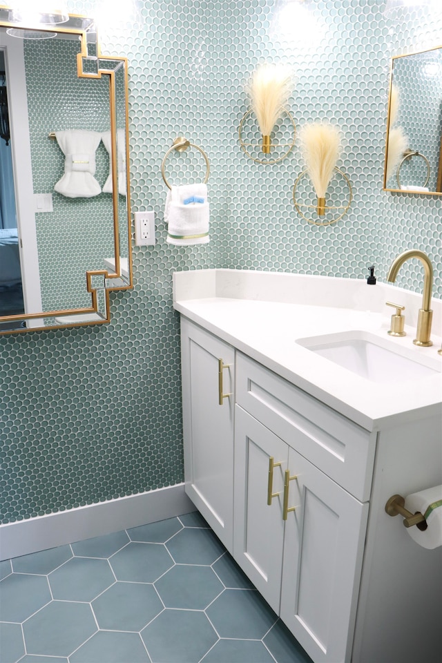 bathroom featuring tile patterned flooring and vanity