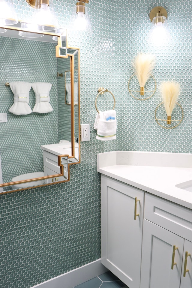 bathroom with tile patterned flooring and vanity