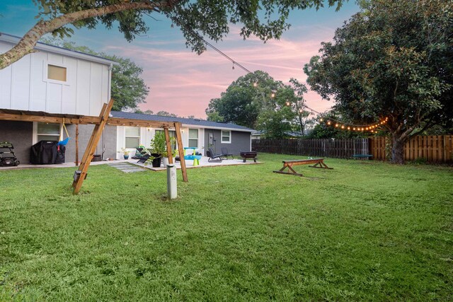 214 Deltona Blvd, Saint Augustine, FL 32086 - yard at dusk featuring a patio