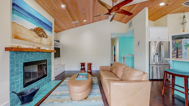 living room featuring a tiled fireplace, dark hardwood / wood-style floors, lofted ceiling, and wood ceiling