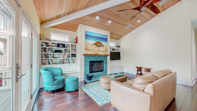 living room featuring a tiled fireplace, lofted ceiling with beams, and wood ceiling