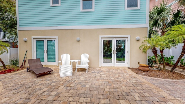 back of property featuring a patio and french doors