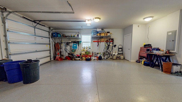 garage featuring a garage door opener and electric panel