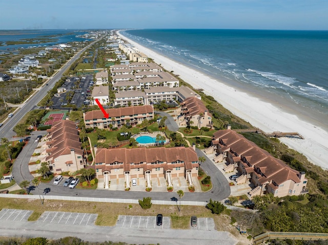 aerial view featuring a water view and a view of the beach