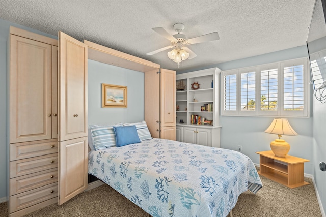 carpeted bedroom with a textured ceiling, a closet, and ceiling fan