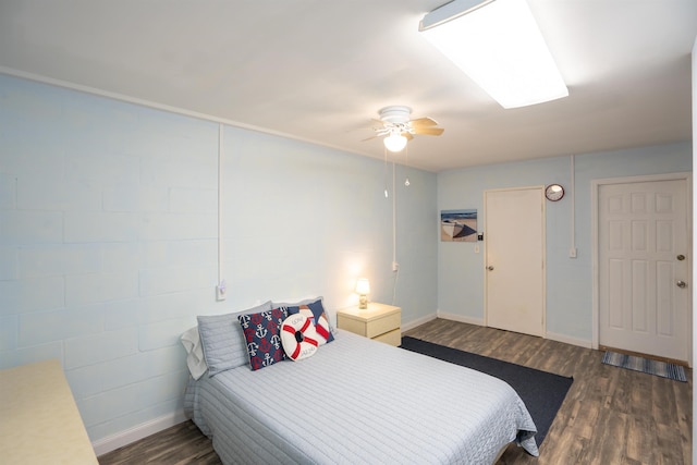 bedroom featuring dark hardwood / wood-style flooring and ceiling fan