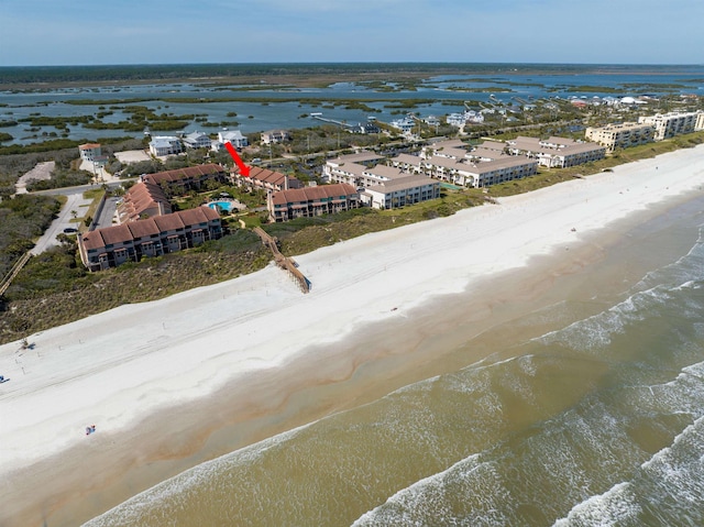 bird's eye view featuring a beach view and a water view