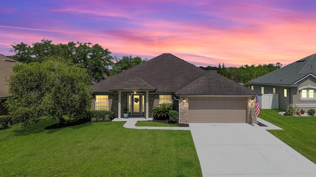 2020 Spring Meadows Ct, Saint Augustine, FL 32092 - view of front facade with an attached garage, driveway, brick siding, and a shingled roof