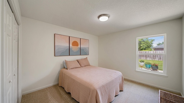2020 Spring Meadows Ct, Saint Augustine, FL 32092 - carpeted bedroom featuring baseboards, a closet, and a textured ceiling