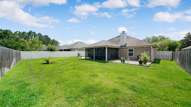 2020 Spring Meadows Ct, Saint Augustine, FL 32092 - back of property featuring a sunroom, a patio, a chimney, and brick siding
