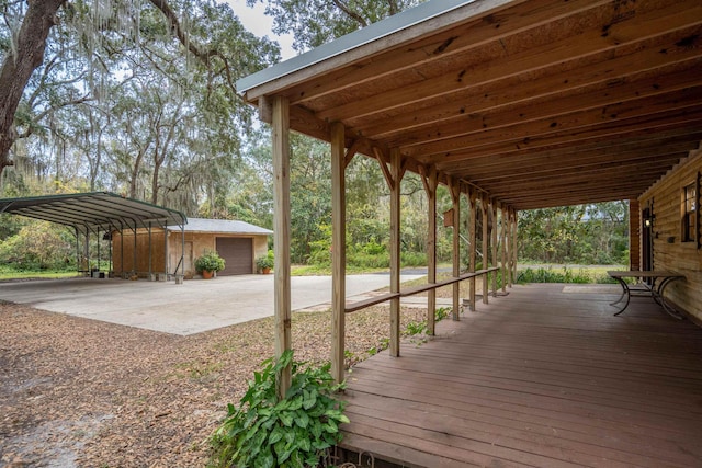 5850 Capo Island Rd, Saint Augustine, FL 32095 - wooden deck with a carport and a detached garage